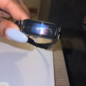 Fitbit luxe - link band has some wear - will come with other bands and charger.